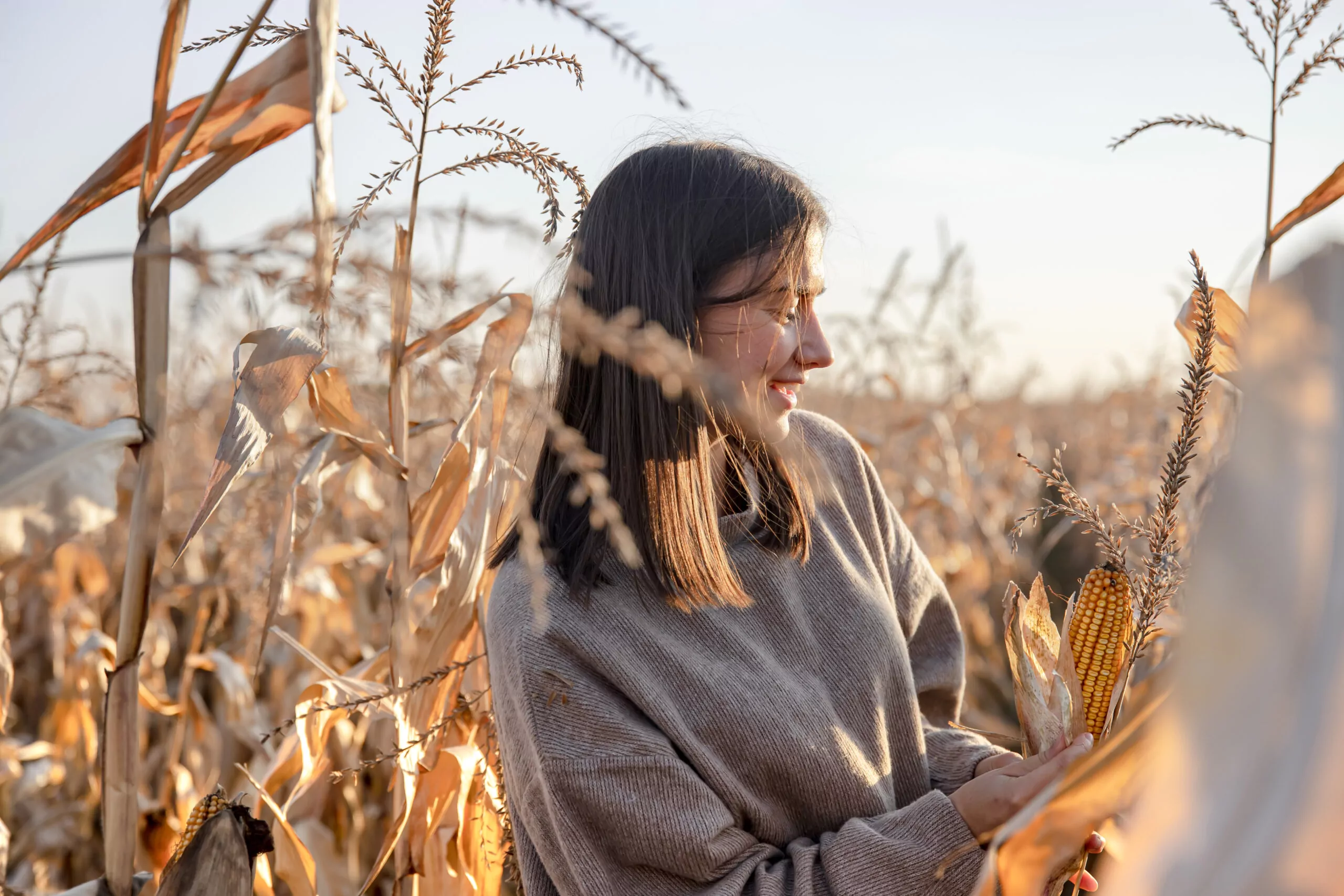 cheerful-young-woman-in-a-cornfield-in-autumn-2021-12-09-15-01-40-utc-scaled