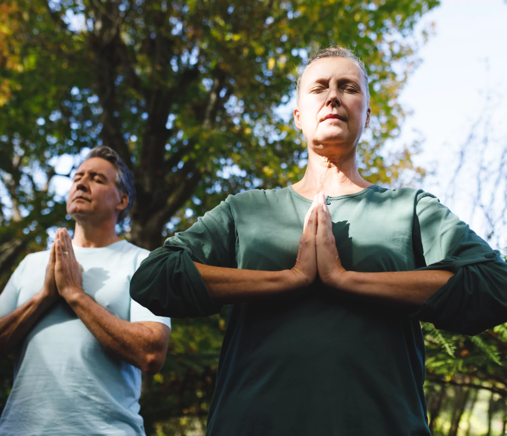 peaceful-senior-caucasian-couple-practicing-yoga-2022-01-18-23-47-07-utc-1-1
