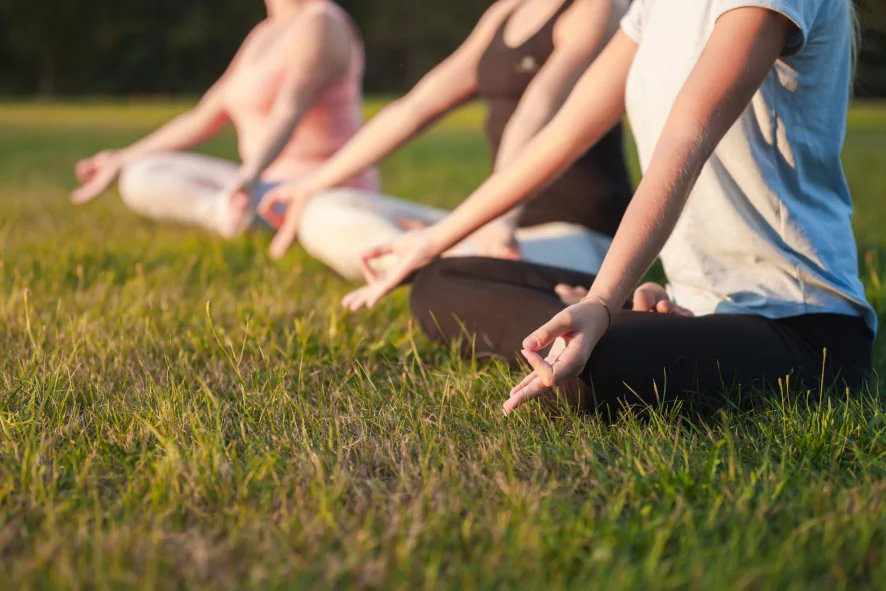 yoga-in-the-park-group-of-people-practicing-yoga-2021-08-29-16-38-55-utc-1